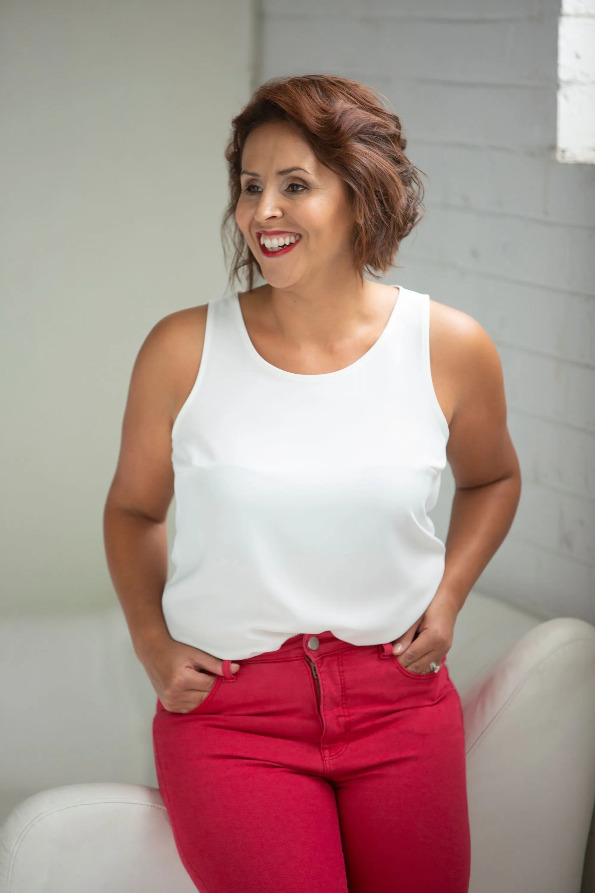 Michelle Barnard-Marks, Founder of BM Solutions, smiling in the studio.